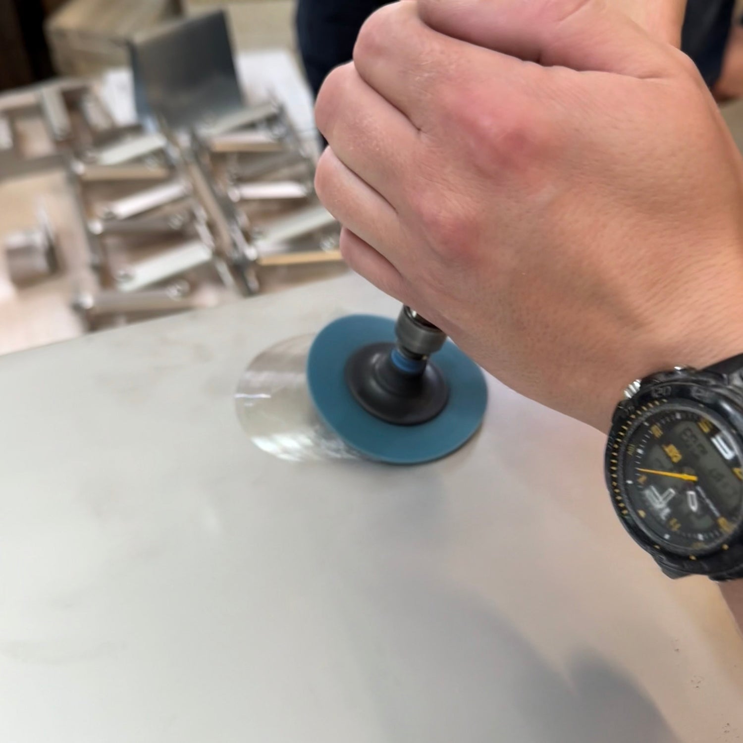 Hand-finishing a stainless steel table by Bendix Angarde — crafted in Denmark with precision and care.