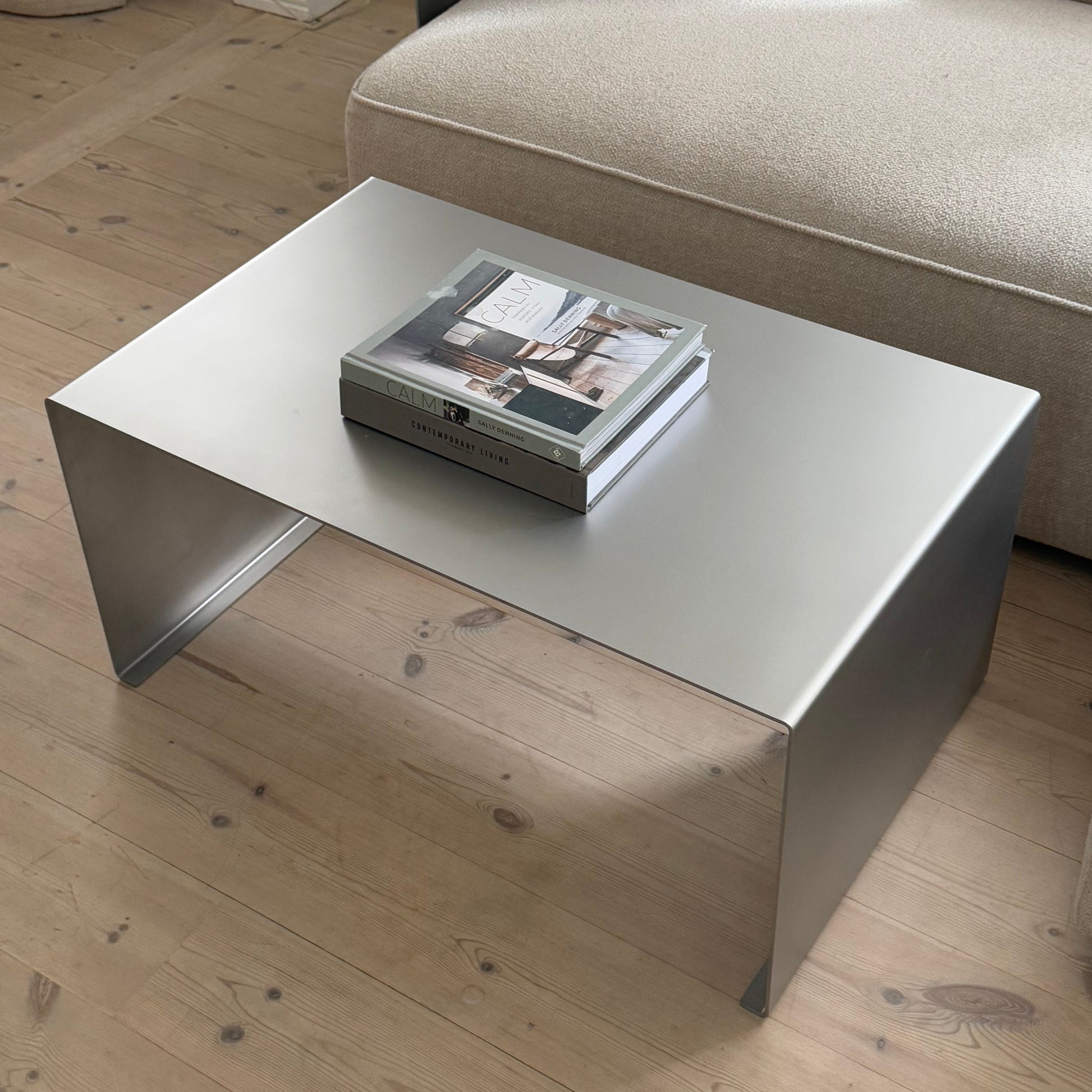 Angled view of the Elegance Coffee Table in a calm living room setting.