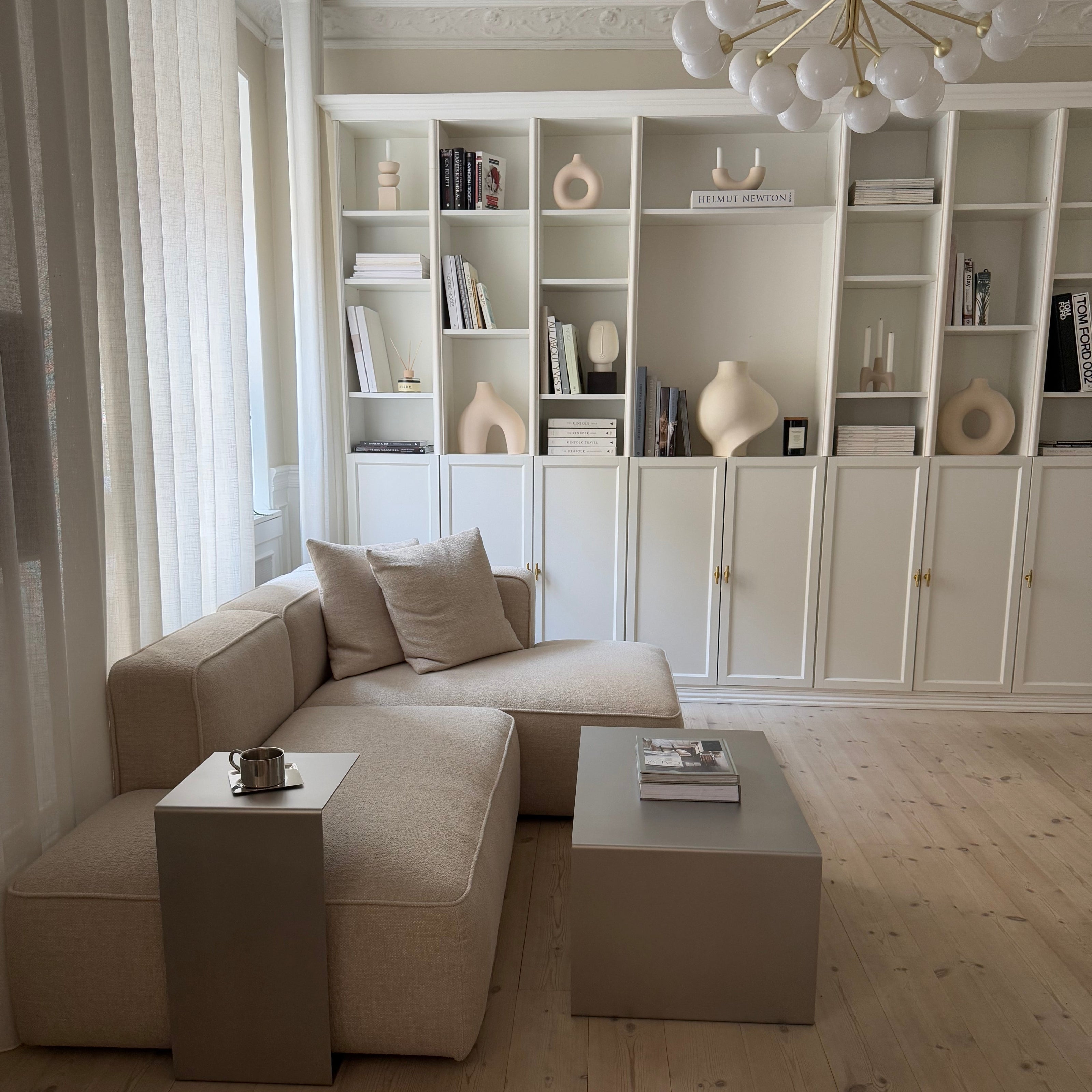 Side composition showing the Elegance Coffee Table in a living room with the Side Table nearby.