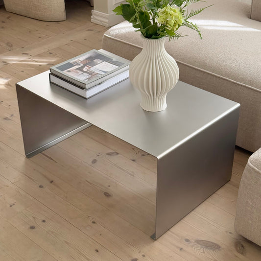 Steel coffee table with satin matte stainless steel finish from the Elegance collection.